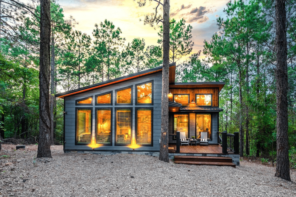 one of our modern cabins in broken bow at sunset